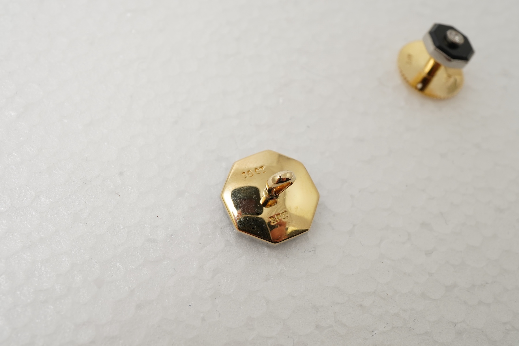 Retailed by Mappin & Webb, an Art Deco onyx and diamond dress set, circa 1920